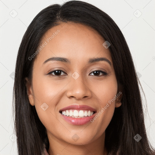 Joyful latino young-adult female with long  brown hair and brown eyes