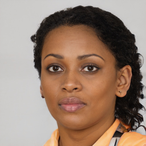 Neutral black young-adult female with long  black hair and brown eyes
