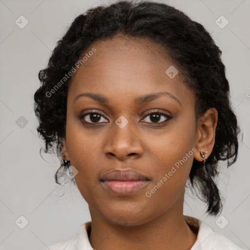 Joyful black young-adult female with medium  black hair and brown eyes