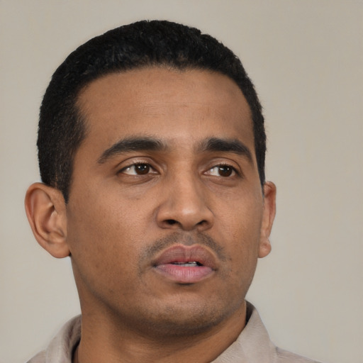 Neutral latino young-adult male with short  black hair and brown eyes