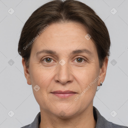 Joyful white adult female with short  brown hair and grey eyes