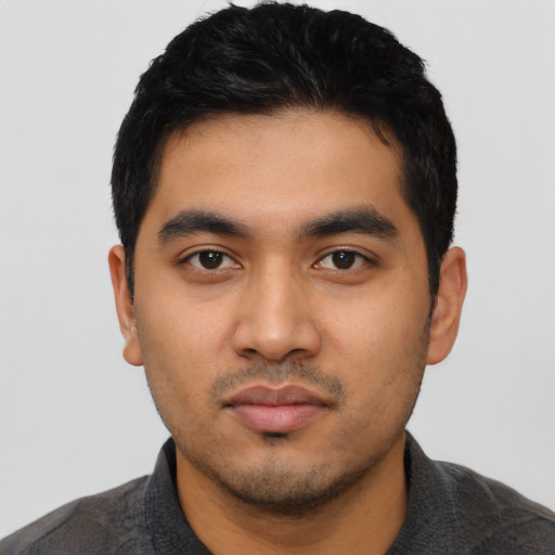 Neutral latino young-adult male with short  black hair and brown eyes