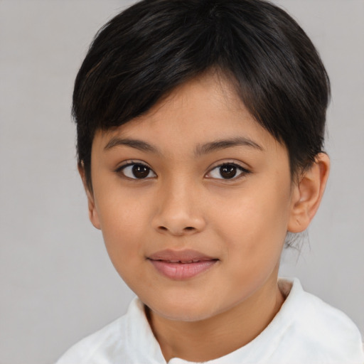 Joyful asian child female with short  brown hair and brown eyes