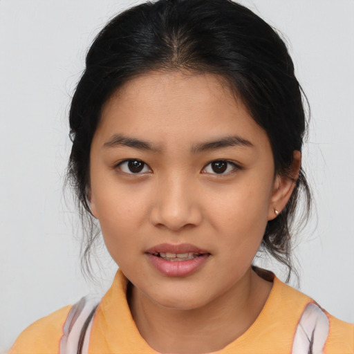Joyful asian young-adult female with medium  brown hair and brown eyes