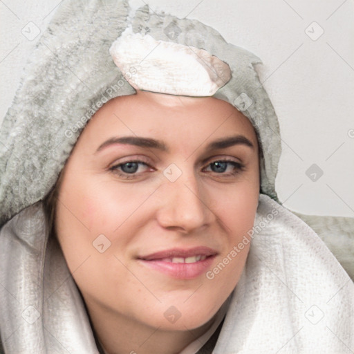 Joyful white young-adult female with medium  brown hair and blue eyes