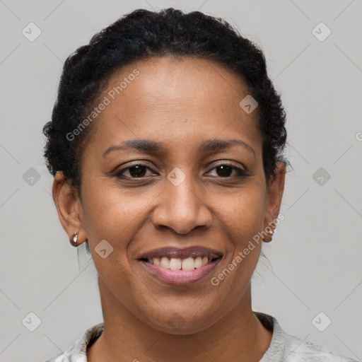 Joyful black adult female with short  brown hair and brown eyes