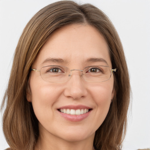 Joyful white young-adult female with long  brown hair and green eyes