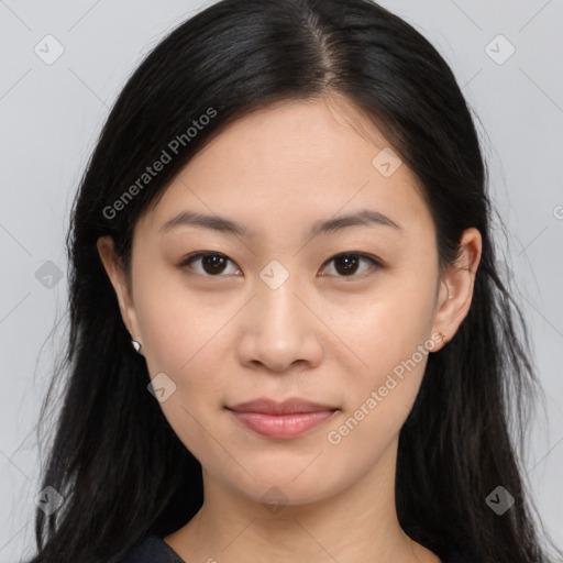 Joyful asian young-adult female with long  brown hair and brown eyes