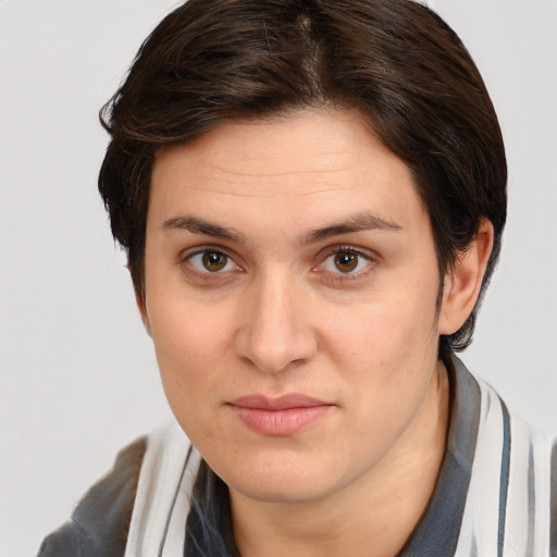 Joyful white young-adult female with medium  brown hair and brown eyes