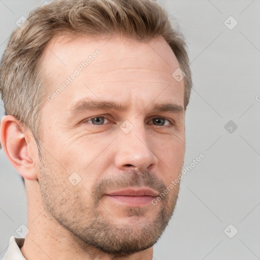 Neutral white adult male with short  brown hair and grey eyes