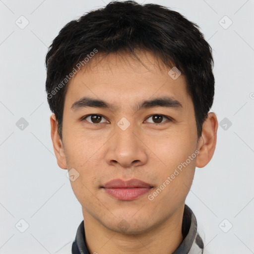 Joyful asian young-adult male with short  black hair and brown eyes