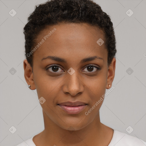 Joyful black young-adult female with short  brown hair and brown eyes