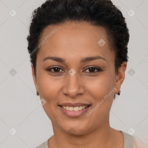 Joyful latino young-adult female with short  brown hair and brown eyes