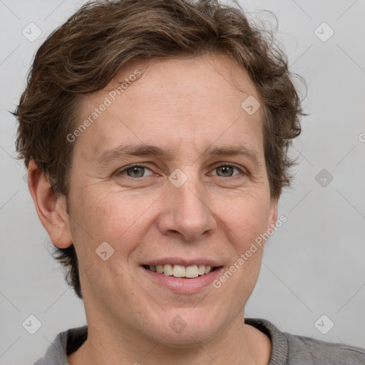 Joyful white adult female with short  brown hair and grey eyes