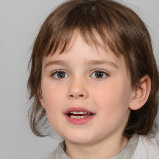 Joyful white child female with medium  brown hair and brown eyes