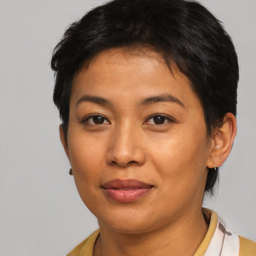 Joyful asian young-adult female with short  brown hair and brown eyes