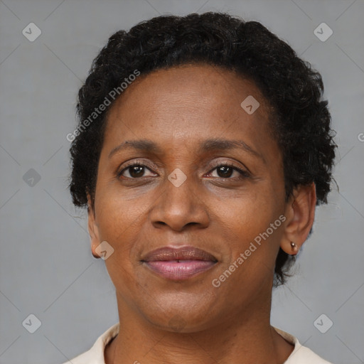 Joyful black adult female with short  brown hair and brown eyes