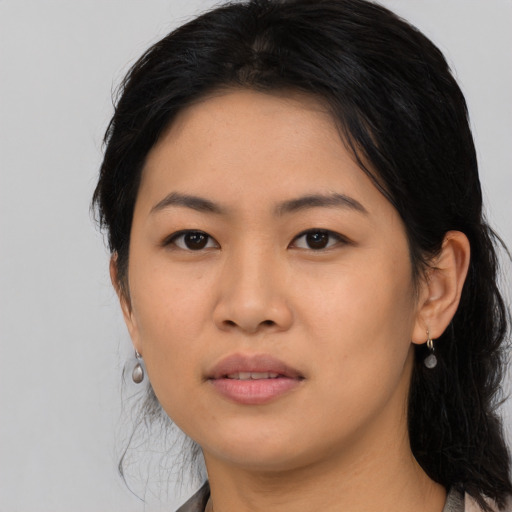 Joyful asian young-adult female with medium  black hair and brown eyes