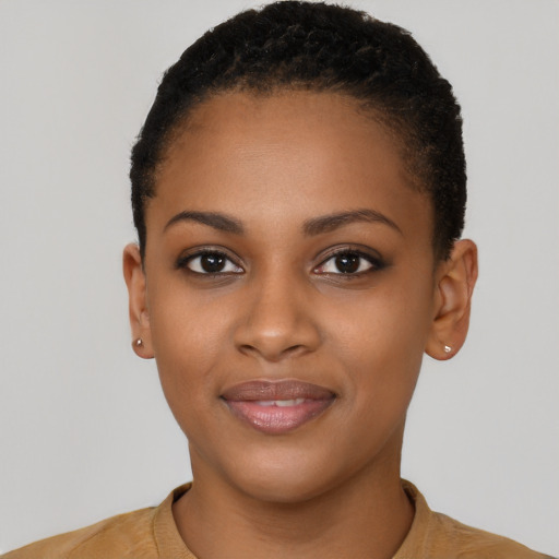 Joyful black young-adult female with short  brown hair and brown eyes