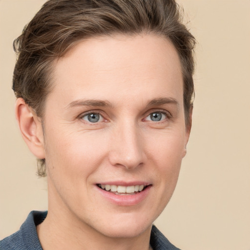 Joyful white young-adult female with short  brown hair and grey eyes