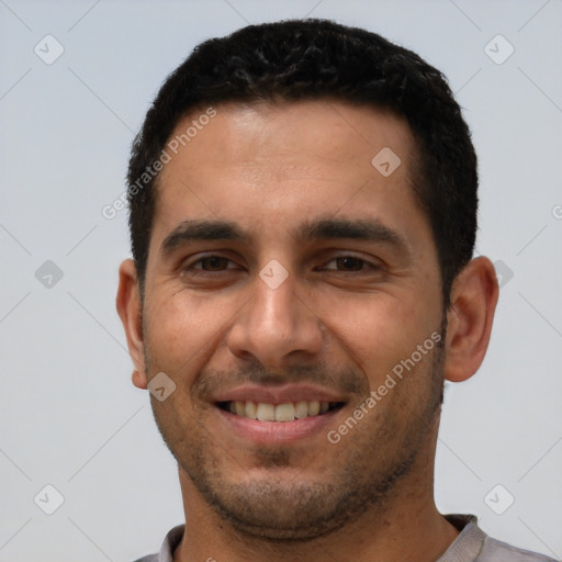 Joyful white young-adult male with short  black hair and brown eyes