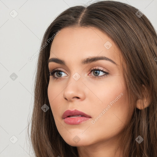 Neutral white young-adult female with long  brown hair and brown eyes