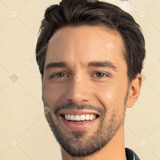 Joyful white young-adult male with short  black hair and brown eyes