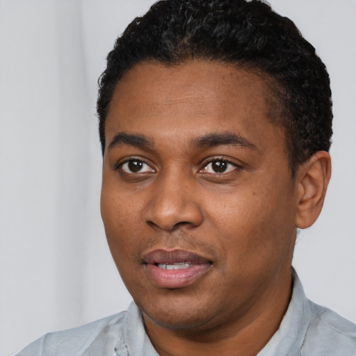Neutral black young-adult male with short  black hair and brown eyes