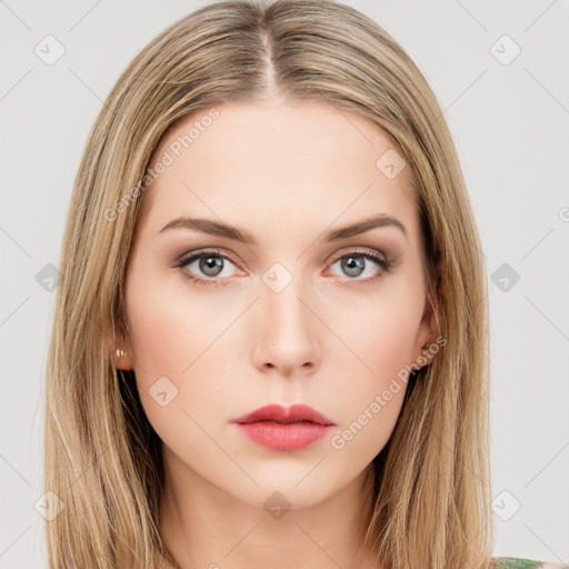 Neutral white young-adult female with long  brown hair and green eyes