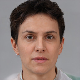 Joyful white adult female with short  brown hair and brown eyes