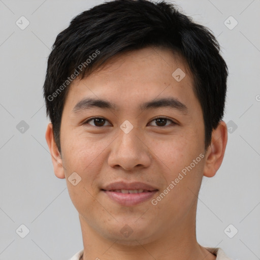 Joyful asian young-adult male with short  brown hair and brown eyes