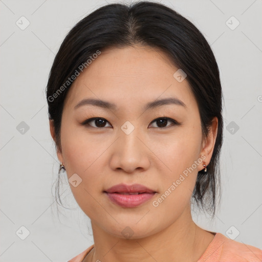 Joyful asian young-adult female with medium  black hair and brown eyes