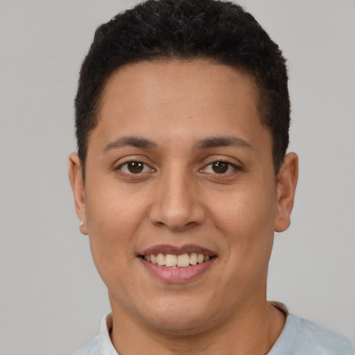 Joyful latino young-adult female with short  brown hair and brown eyes
