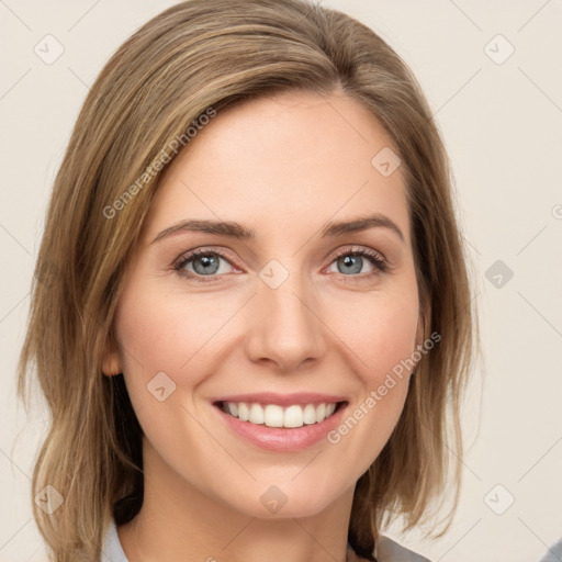 Joyful white young-adult female with medium  brown hair and green eyes