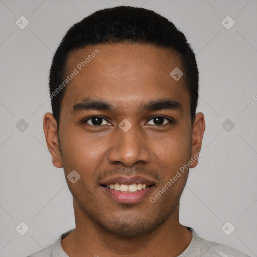 Joyful black young-adult male with short  black hair and brown eyes