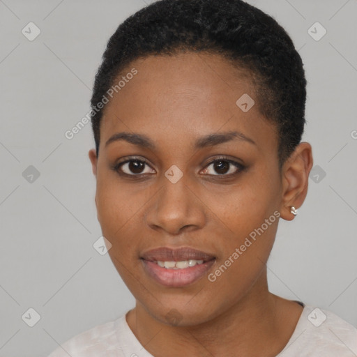 Joyful black young-adult female with short  black hair and brown eyes