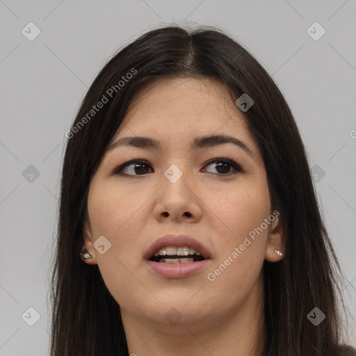 Joyful asian young-adult female with long  brown hair and brown eyes