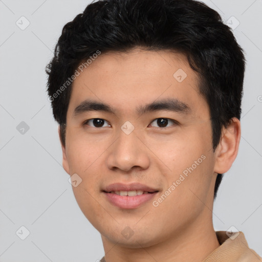 Joyful asian young-adult male with short  brown hair and brown eyes