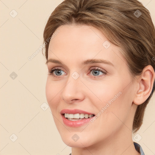 Joyful white young-adult female with medium  brown hair and blue eyes