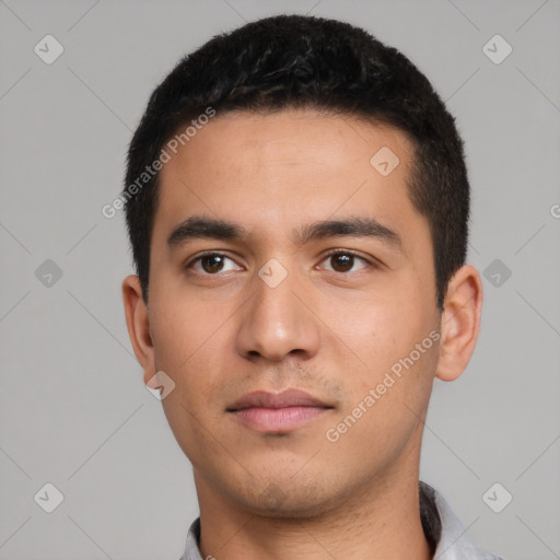 Neutral latino young-adult male with short  black hair and brown eyes