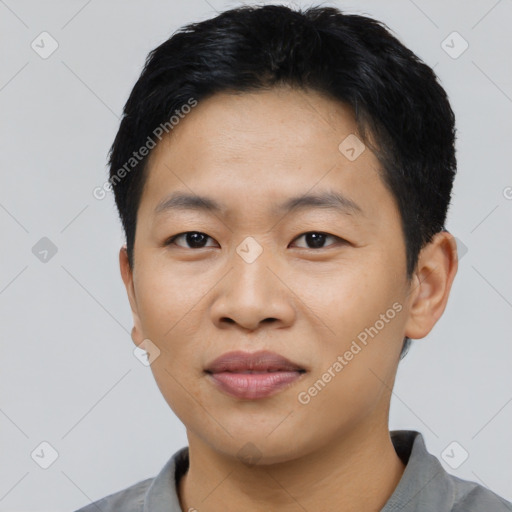 Joyful asian young-adult male with short  black hair and brown eyes