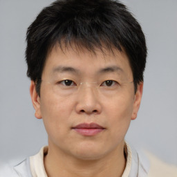 Neutral asian young-adult male with short  brown hair and brown eyes