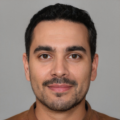 Neutral latino young-adult male with short  black hair and brown eyes