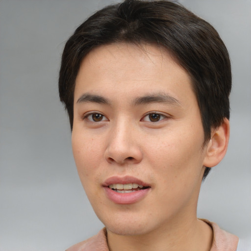 Joyful asian young-adult male with short  brown hair and brown eyes