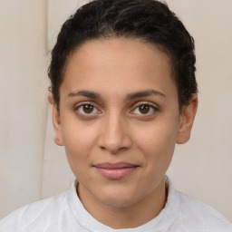 Joyful latino young-adult female with short  brown hair and brown eyes