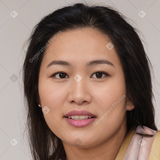 Joyful asian young-adult female with long  brown hair and brown eyes