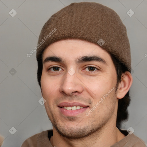 Joyful white young-adult male with short  black hair and brown eyes