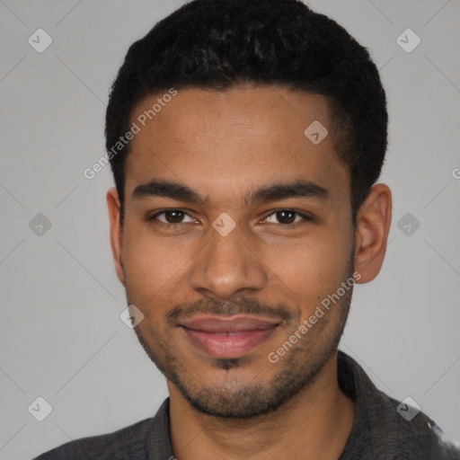 Joyful black young-adult male with short  brown hair and brown eyes