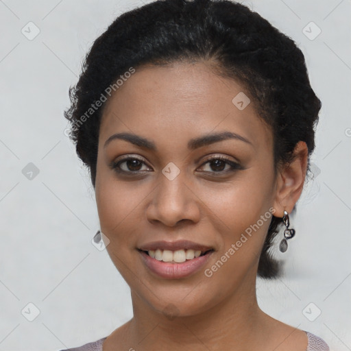 Joyful latino young-adult female with short  black hair and brown eyes