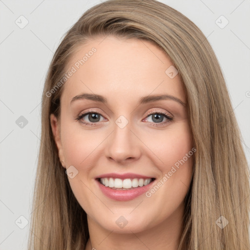 Joyful white young-adult female with long  brown hair and grey eyes